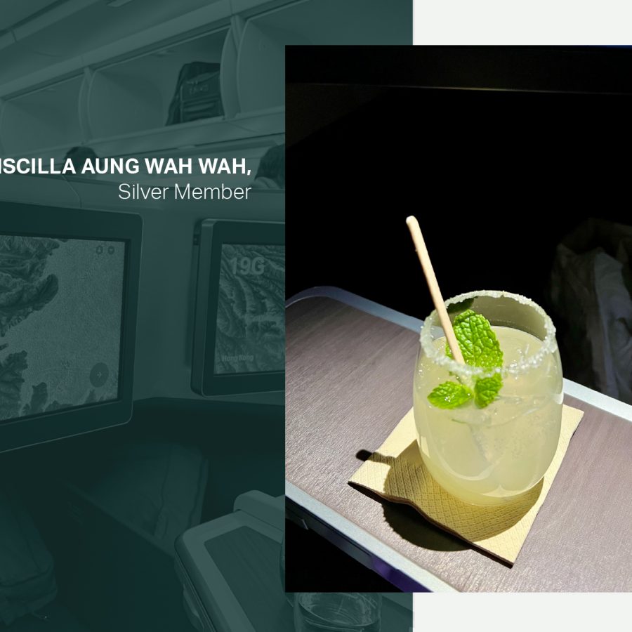 A glass of the Cathay Delight mocktail on the pull-out tray on board a Cathay Pacific flight